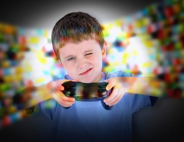 Boy Playing Video Game Controller